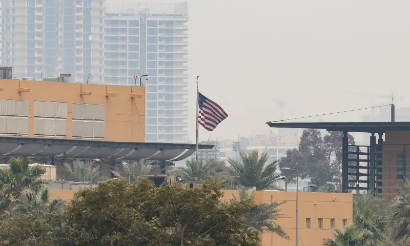 The US flag flies at the US Embassy, after Iraqi security sources said the embassy was hit in a missile attack, in Baghdad on March 14, 2026. &mdash; Reuters