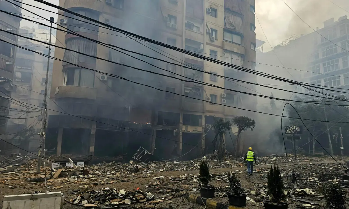  A rescuer arrives at the site of an Israeli airstrike on a residential blocks in Beirut&rsquo;s southern suburb of Haret Hreik on March 15, 2026. &mdash; AFP