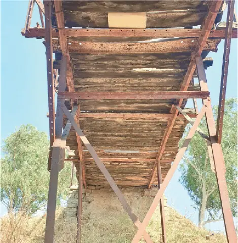  The wooden planks expose the dilapidated condition of the mini flyover from beneath. 