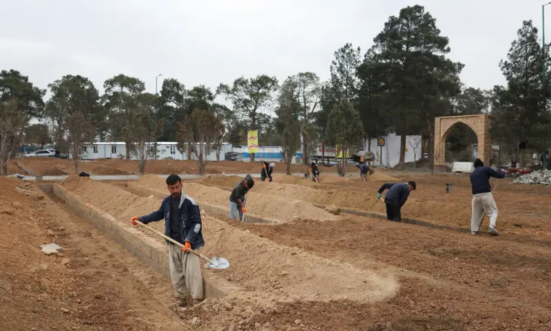 Workers construct graves at the Behesht-e Zahra cemetery, amid the U.S.-Israeli conflict with Iran, in Tehran, Iran, March 16, 2026. — Reuters