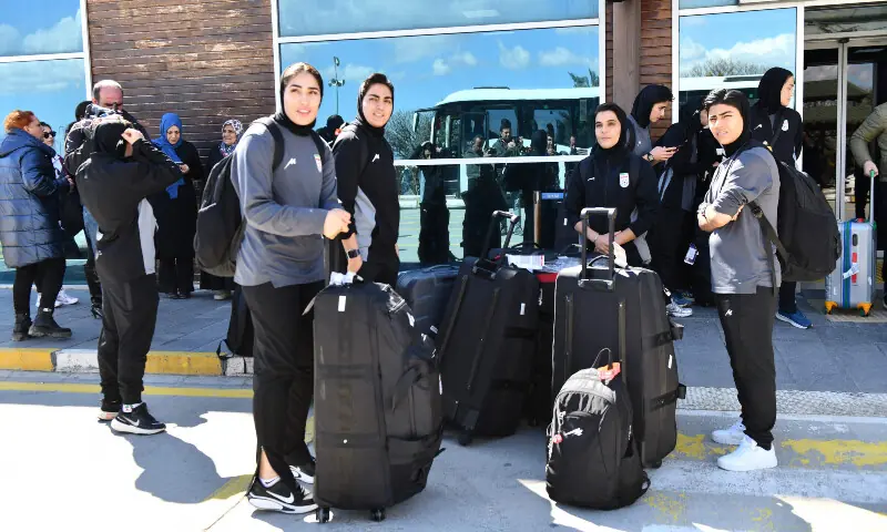Members of Iran&rsquo;s women&rsquo;s football team stand at Igdir airport, waiting to reach Dogubeyazit, in Igdir on March 18, 2026. &mdash; AFP
