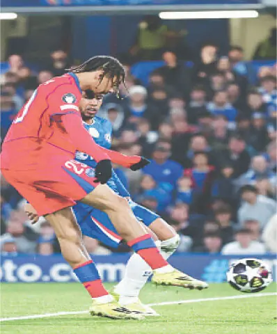  LONDON: Paris St Germain&rsquo;s Bradley Barcola (front) scores during the match against Chelsea at Stamford Bridge.&mdash;Reuters 