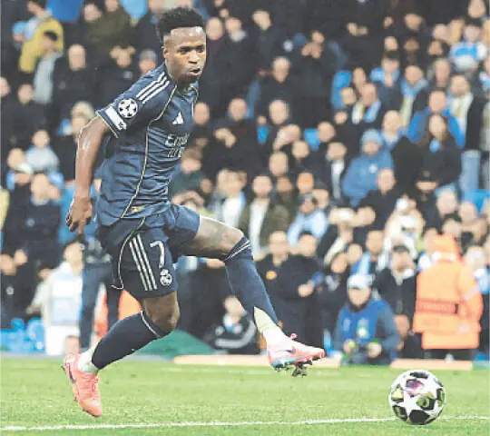  MANCHESTER: Real Madrid&rsquo;s Vinicius Junior scores during the match against Manchester City at the  Etihad Stadium.&mdash;Reuters 