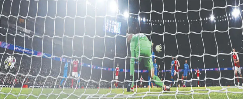  LONDON: Bayer Leverkusen goalkeeper Janis Blaswich concedes a goal by Arsenal&rsquo;s Declan Rice during their Champions League last-16 second leg at the Emirates Stadium.&mdash;AFP 