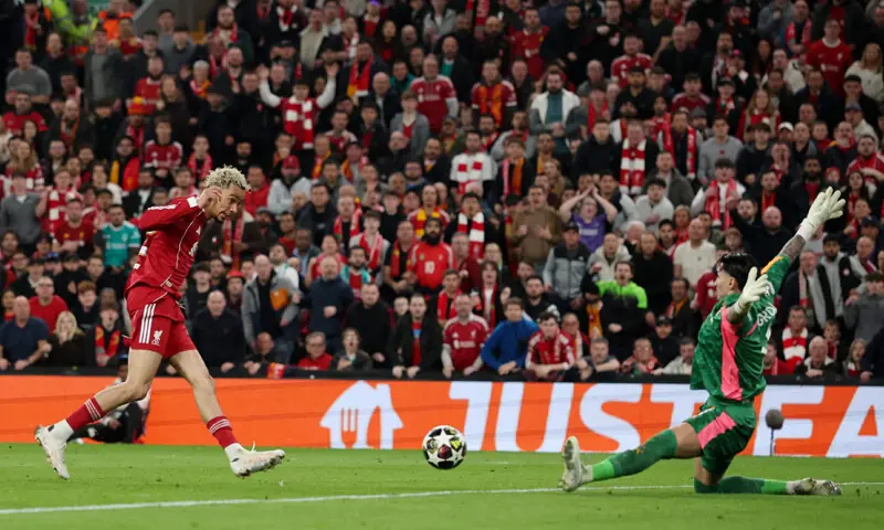  LIVERPOOL: Hugo Ekitike of Liverpool scores past Galatasaray goalkeeper Ugurcan Cakir during their Champions League round-of-16 match at Anfield.&mdash;Reuters 
