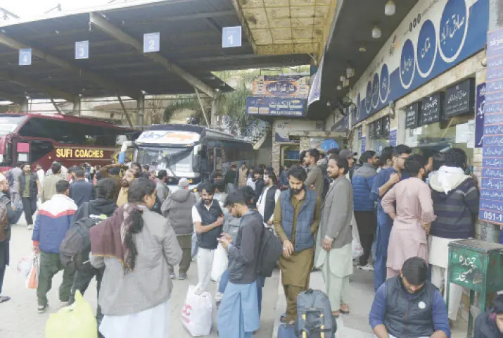  Crowds gather at Rawalpindi Railway Station and the Faizabad bus terminal on Thursday as they travel to their hometowns to celebrate Eid with their loved ones. &mdash; Photos by Mohammad Asim 