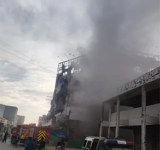  Smoke billows out of the Gul Plaza structure on Sunday.&mdash;Dawn 