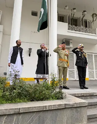 OFFICIALS raise the star and crescent at the Pakistan embassy in Tehran.—X / AmbMudassir