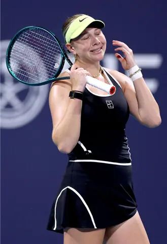 AMANDA Anisimova of the US reacts during the round-of-16 match against Switzerland Belinda Bencic at the Hard Rock Stadium.—AFP