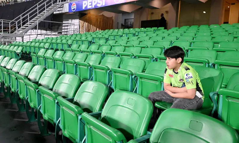  LAHORE: A fan sitting alone in the empty stands during the match.&mdash; Online/M. Arif/White Star 