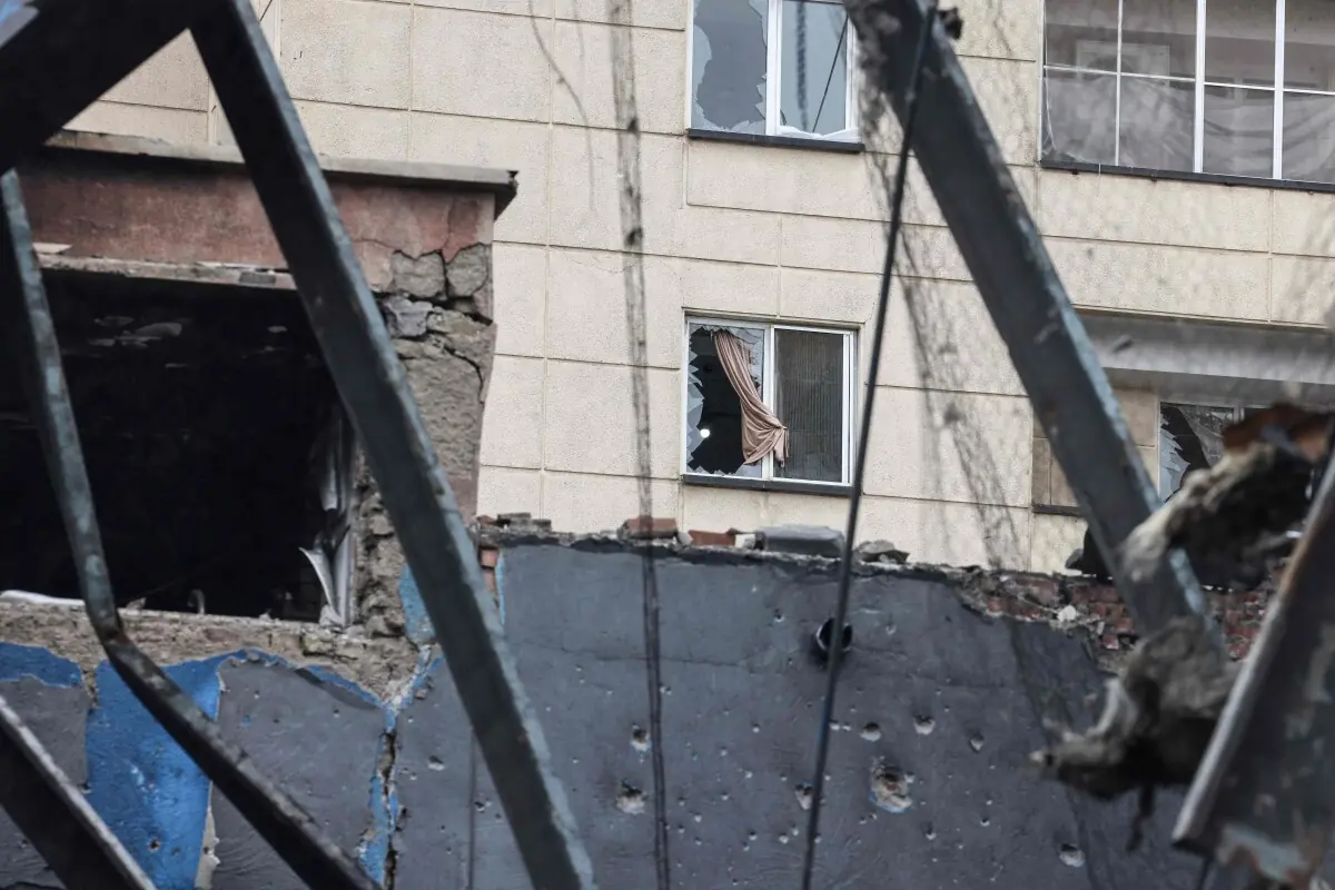 A photograph shows the damage to a nearby building during the visit of a car service centre in eastern Tehran that was hit by a missile strike, amid the US-Israeli war on Iran, on March 28, 2026. &mdash; AFP