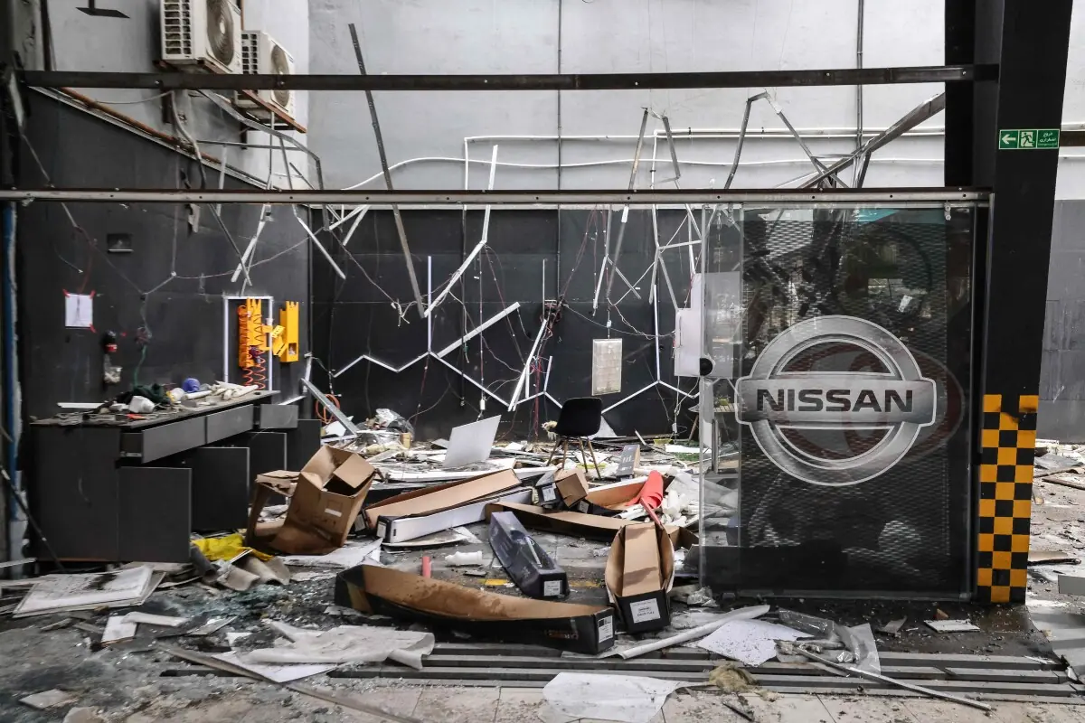 Debris litters the ground at car service centre in eastern Tehran that was hit by a missile strike, amid a US-Israeli war on Iran, on March 28, 2026. &mdash; AFP