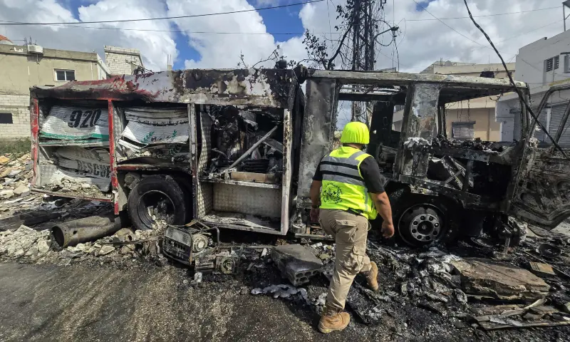 A first responder works at the site of an Israeli airstrike in the southern Lebanese village of Hanouiyeh, east of Tyre, on March 30, 2026. — AFP