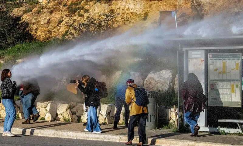 Israeli security forces use water cannon to disperse protesters that had gathered outside the Knesset, the Israeli parliament, in Jerusalem on March 31, 2026. — AFP