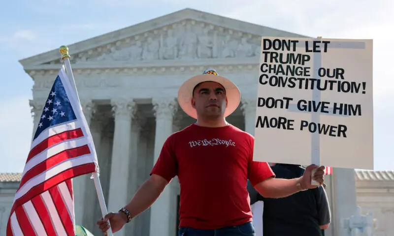 Demonstrators hold signs outside the US Supreme Court building on the day the court is expected to hear oral arguments on the legality of the Trump administration&rsquo;s effort to limit birthright citizenship for the children of immigrants, in Washington, D.C., US, April 1, 2026. &mdash; Reuters