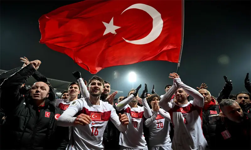  PRISTINA: Turkey&rsquo;s players celebrate after overpowering Kosovo in the play-off at the Fadil Vokrri Stadium.&mdash;AFP 