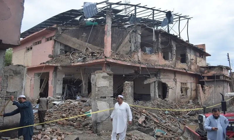 Citizens engage in relief activities on Friday morning after the suicide bombing. — Photo by author