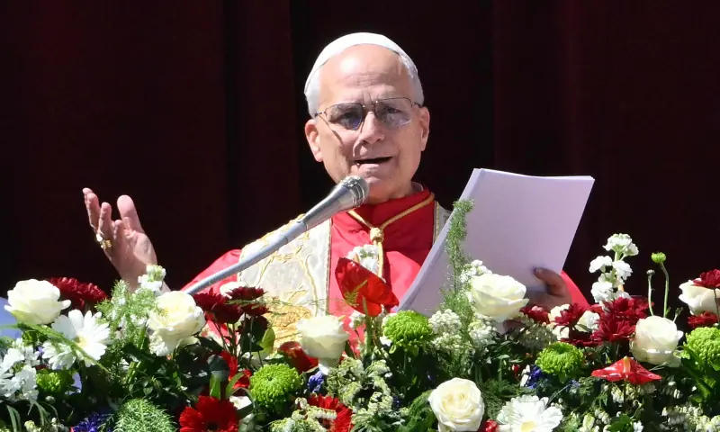 Pope Leo XIV addresses the crowd from the main balcony of St. Peter’s basilica for the Urbi et Orbi message and blessing to the city and the world as part of Easter celebrations, at St Peter’s square in the Vatican on April 5, 2025. — AFP