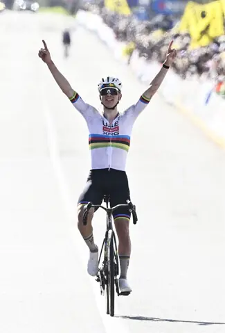  UAE Team Emirates&rsquo; Tadej Pogacar of Slovenia celebrates as he crosses the finish line to win the Tour of Flanders&rsquo; UCI World Tour race on Sunday.&mdash;AFP 