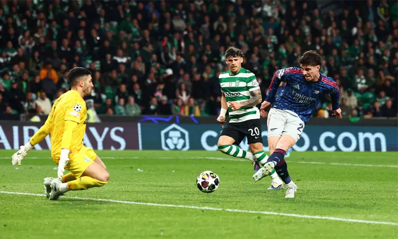 LISBON: Arsenal’s Kai Havertz shoots to score past Sporting Lisbon goalkeeper Rui Silva during their quarter-final first leg at Estadio Jose Alvalade.—Reuters