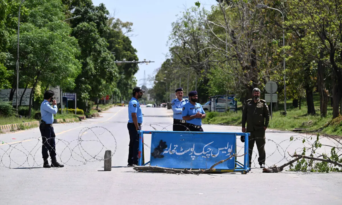 Policemen stand guard at a blocked road in the Red Zone area in Islamabad on April 9, 2026. &mdash; AFP