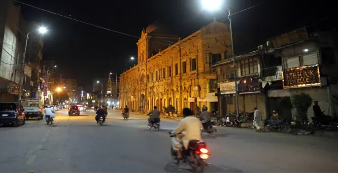 KARACHI: Shops along the road are closed, and vehicular traffic is light in the city’s usually bustling Saddar area, giving the thoroughfare a deserted look after the Sindh government ordered businesses to shut down by 9pm.—Shakeel Adil / White Star