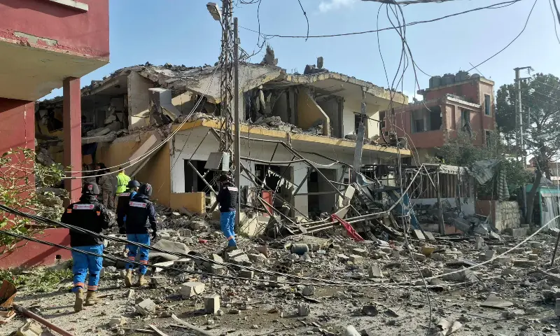 First responders gather at the site of an Israeli airstrike that targeted a neighbourhood in the southern Lebanese village of Kfar Roummane, on April 13, 2026. — AFP