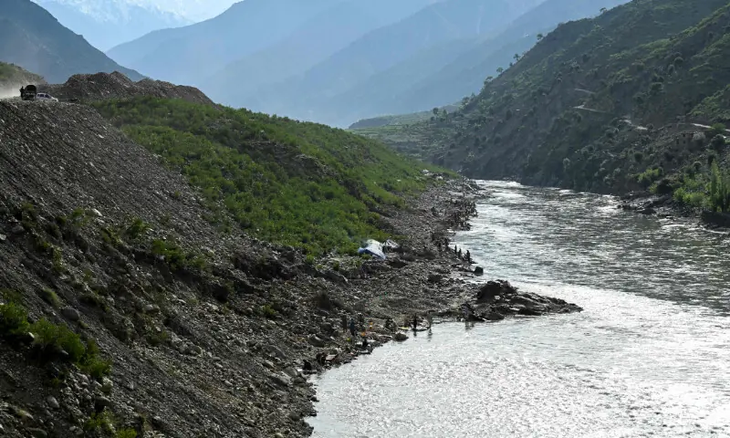 This photograph taken on April 13, 2026 shows Afghan men digging a mountainside along the Kunar riverbed before seiving stones in search of gold nuggets in the Song area of Ghaziabad district, Kunar province. &mdash; AFP