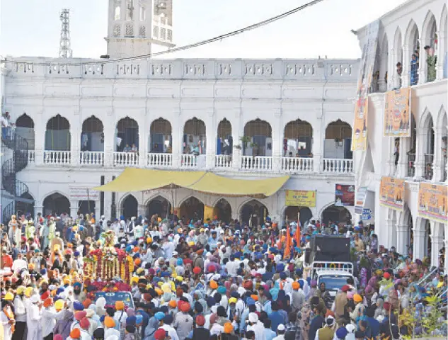   A Granthi reads the Guru Granth Sahib during the Bhog ceremony.  