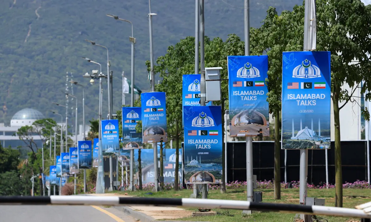 Hoardings are mounted on lamp posts, as Pakistan prepares to host the United States and Iran for a possible second phase of peace talks in Islamabad, Pakistan, April 20, 2026. &mdash; Reuters