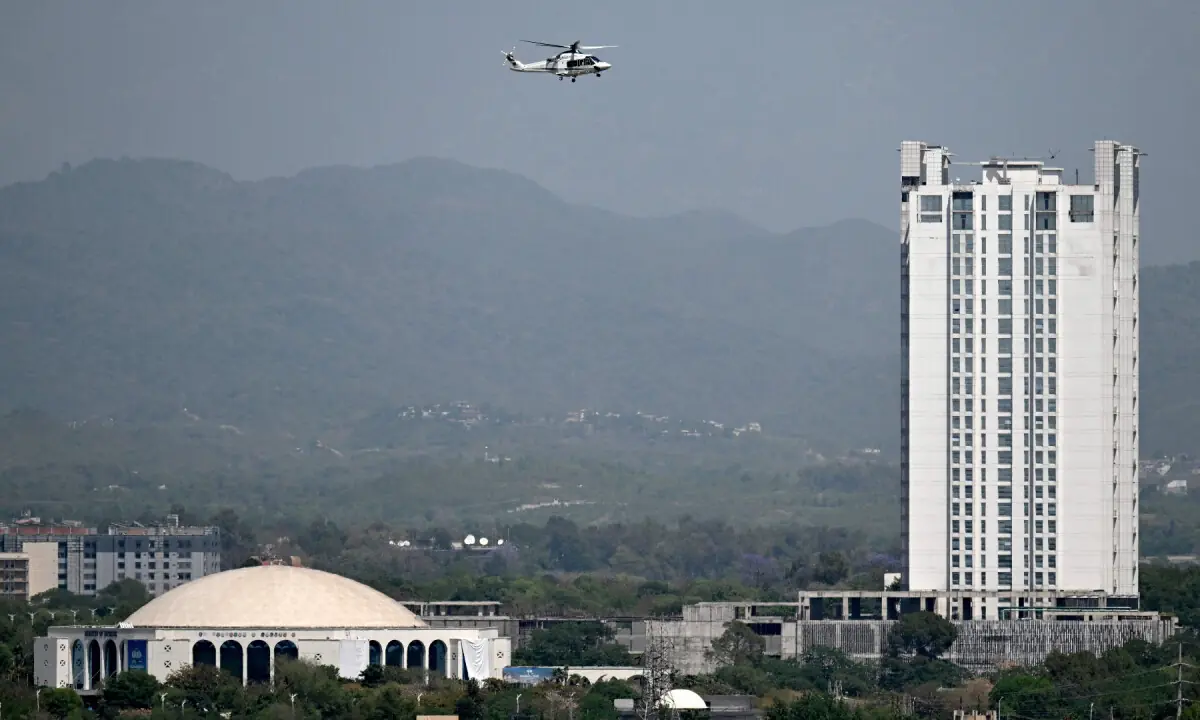 A helicopter flies over the Red Zone area in Islamabad on April 20, 2026. &mdash; Reuters
