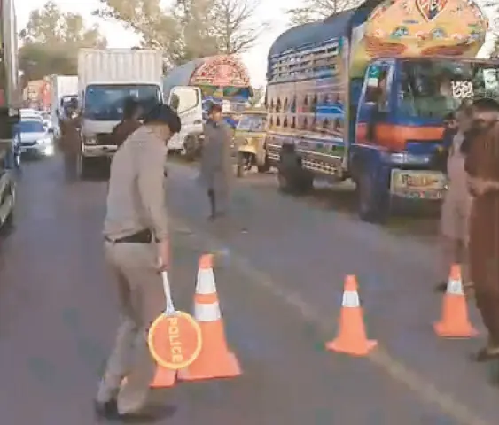   GUJRAT: Heavy vehicles parked along the GT Road. &mdash; Dawn  