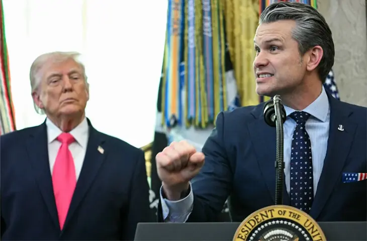   President Donald Trump looks on as US Secretary of Defence Pete Hegseth speaks at the White House in Washington, DC on March 24, 2026: Trump doesn&rsquo;t have many good choices. Bluster aside, he can&rsquo;t really escalate without bombing targets that would make him a war criminal under existing International Law provisions | AFP  