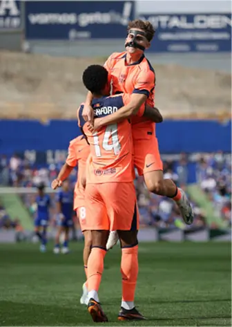  GETAFE: Barcelona&rsquo;s Marcus Rashford (bottom) celebrates after scoring against Getafe with team-mate Fermin Lopez during their La Liga match at the Coliseum Stadium on Saturday.&mdash;Reuters 