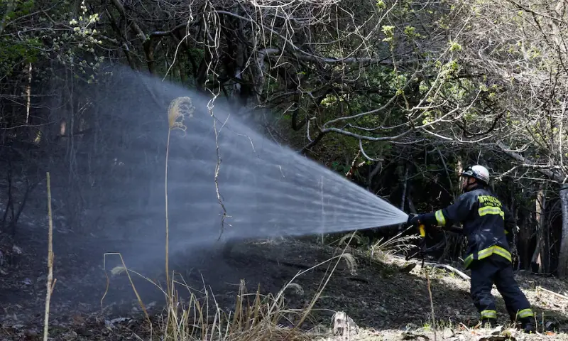   A firefighter works as wildfires continue in Otsuchi, Iwate Prefecture, Japan on April 26, 2026. &mdash; Reuters  