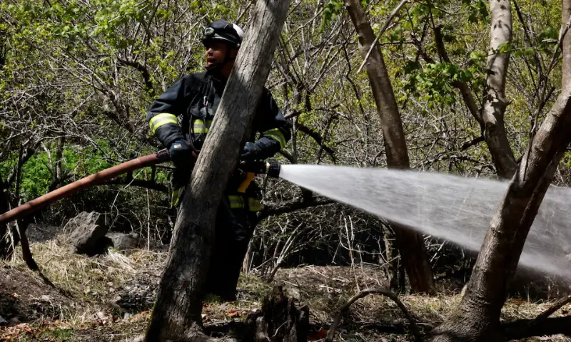   A firefighter works as wildfires continue in Otsuchi, Iwate Prefecture, Japan on April 26, 2026. &mdash; Reuters  