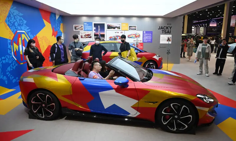 Visitors try out an MG Cyberster at the Beijing Auto Show in Beijing on April 26, 2026. &mdash; AFP
