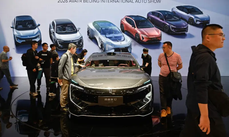 Visitors look at an Avatr 12 at the Beijing Auto Show in Beijing on April 26, 2026. &mdash; AFP