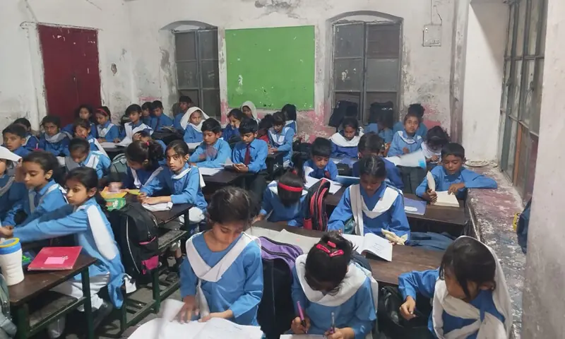   Students studying in a classroom of the school.  