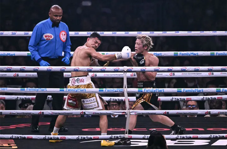  JAPAN&rsquo;S Naoya Inoue (R) lands a punch on compatriot Junto Nakatani during their super bantamweight championship bout at the Tokyo Dome on Saturday.&mdash;AFP 