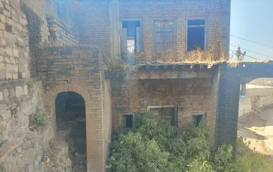 A view of the crumbling bungalow of Raja Nadir Khan located opposite to the mosque.