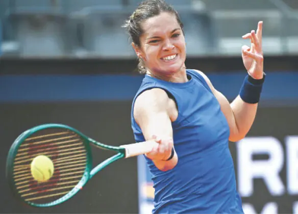  CATY McNally of the US plays a forehand against Poland&rsquo;s Iga Swiatek during their Italian Open second round match at Foro Italico on Friday.&mdash;AFP 