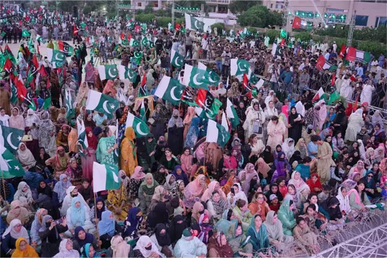 A large number of PPP workers, including women, gather at Seaview to participate in a programme to commemorate Marka-i-Haq.—Dawn
