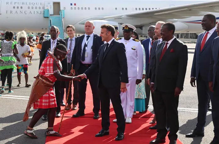  Nairobi: President Emmanuel Macron greets a traditional dancer upon his arrival ahead of the Africa Forward: Africa-France Partnerships for Innovation and Growth Summit on Sunday.&mdash;AFP 