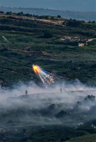 An explosion of what appears to be white phosphorus fired by IDF on Lebanon on Sunday.—Reuters