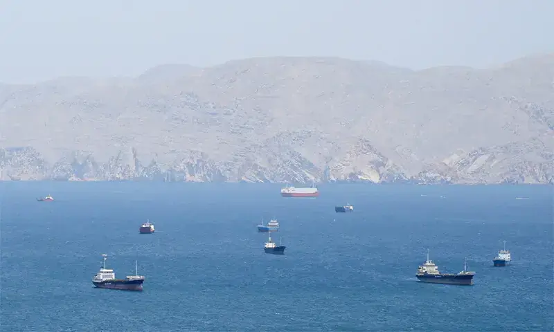 Only a handful of vessels can be seen crossing the Strait of Hormuz off the coast of Oman on April 27, 2026.&mdash;Reuters