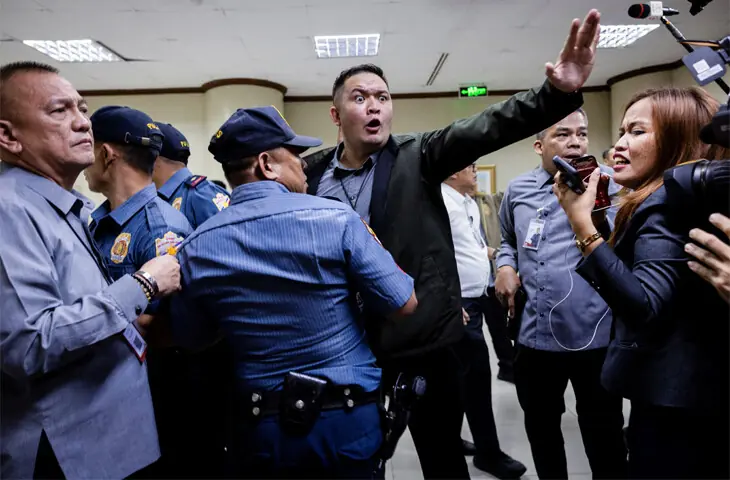 SECURITY personnel ask journalists to stay back after gunshots were heard at the Philippine senate.—Reuters