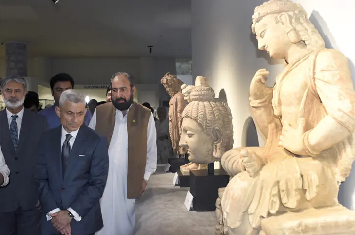 US Assistant Secretary of State for South and Central Asian Affairs S. Paul Kapur looks at rare Gandhara artifacts repatriated from the US at Islamabad Museum on Wednesday. — Photo by Tanveer Shahzad