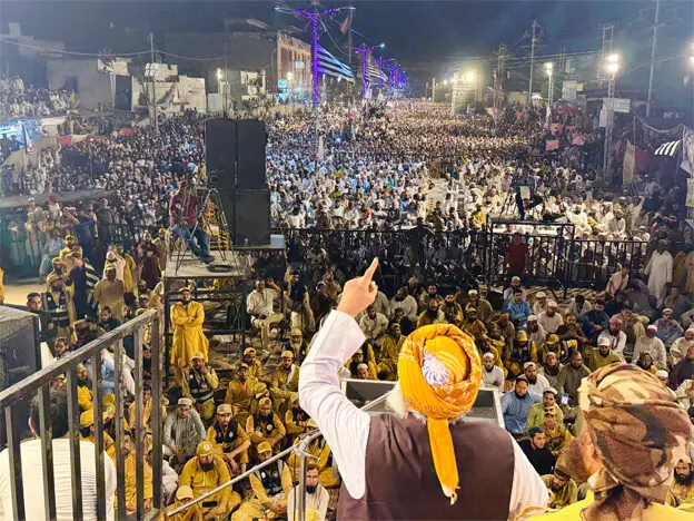 JUI-F chief Maulana Fazlur Rehman addresses the congregation near Naya Nazimabad on Thursday.—Dawn