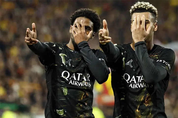  LENS: PSG&rsquo;s Ibrahim Mbaye (L) celebrates with team-mate Desire Doue after scoring against RC Lens during their Ligue 1 match at the Stade Bollaert-Delelis Stadium.&mdash;AFP 